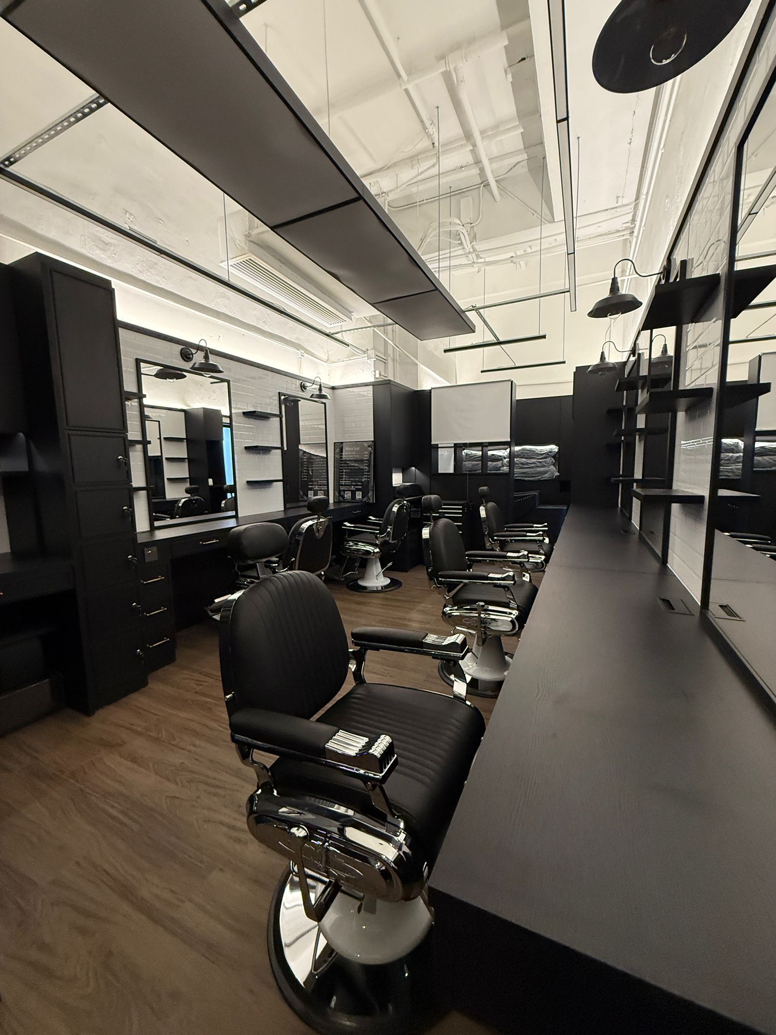 Styling stations and barber chairs at The Real Barbershop